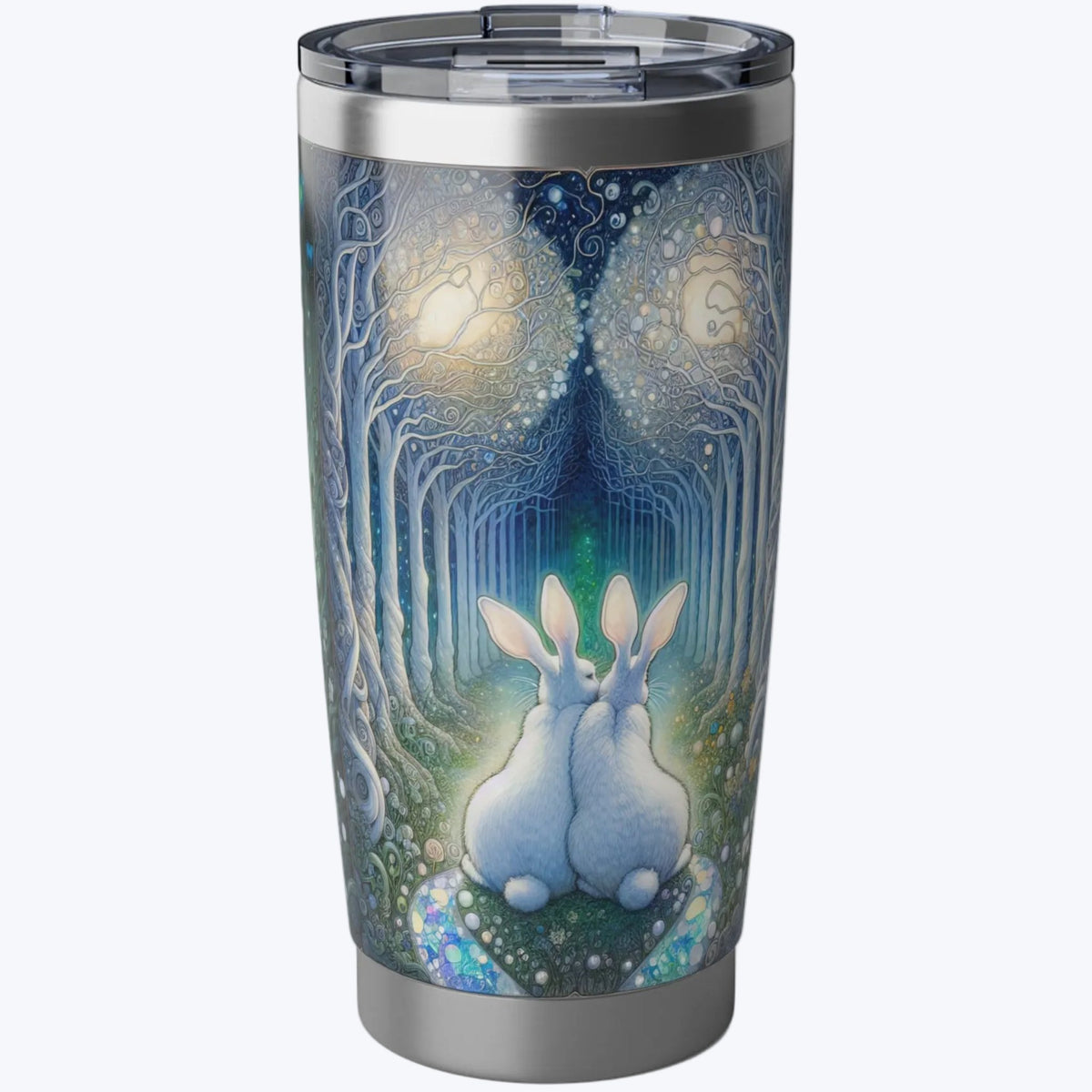 Enchanted Bunny Rabbit Love Trail Chrome Tumbler -- a stainless steel travel tumbler with a clear lid, featuring a detailed fantasy illustration of two white rabbits sitting in a glowing blue and green forest with glowing orbs.