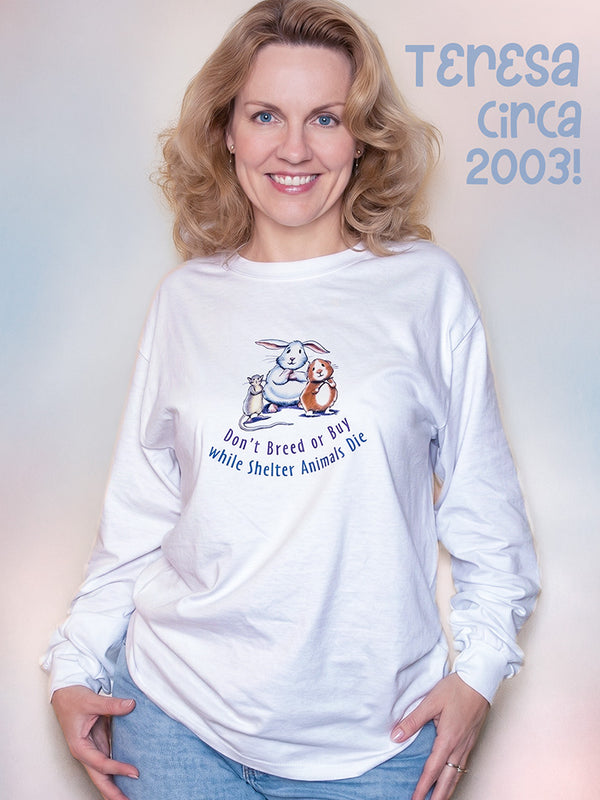 Teresa Murphy wearing a white long-sleeve shirt with a graphic guinea pig rescue design and text, standing against a light background.