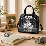 Echoes in Ink shoulder handbag and matching round key ring styled on a guinea pig lover's desk – image 4
