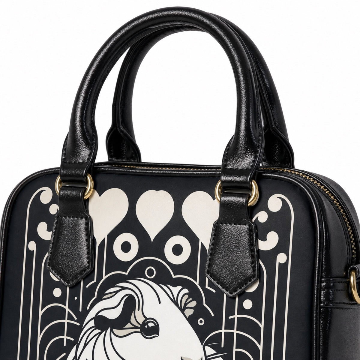 Black shoulder handbag handles, gold-tone hardware, zipper, stitching, and printed material detail